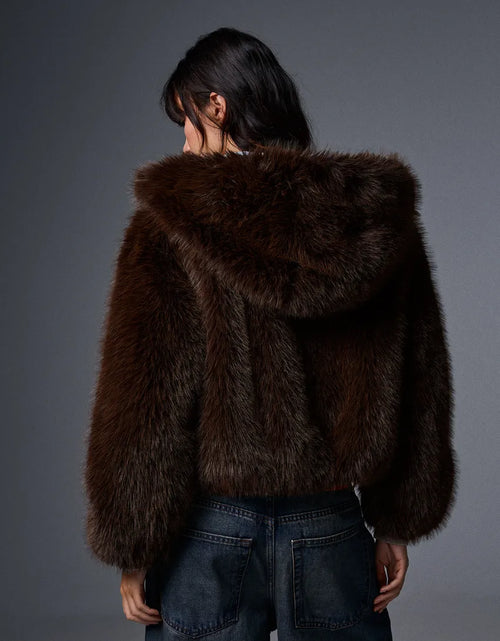 Blouson fourrure à capuche